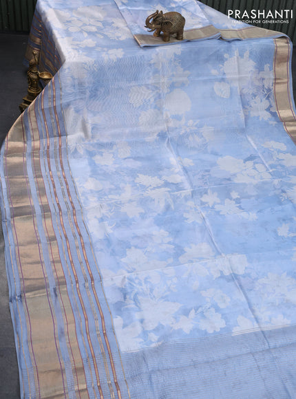 Pure dupion silk saree blue shade with allover floral prints and long zari woven border