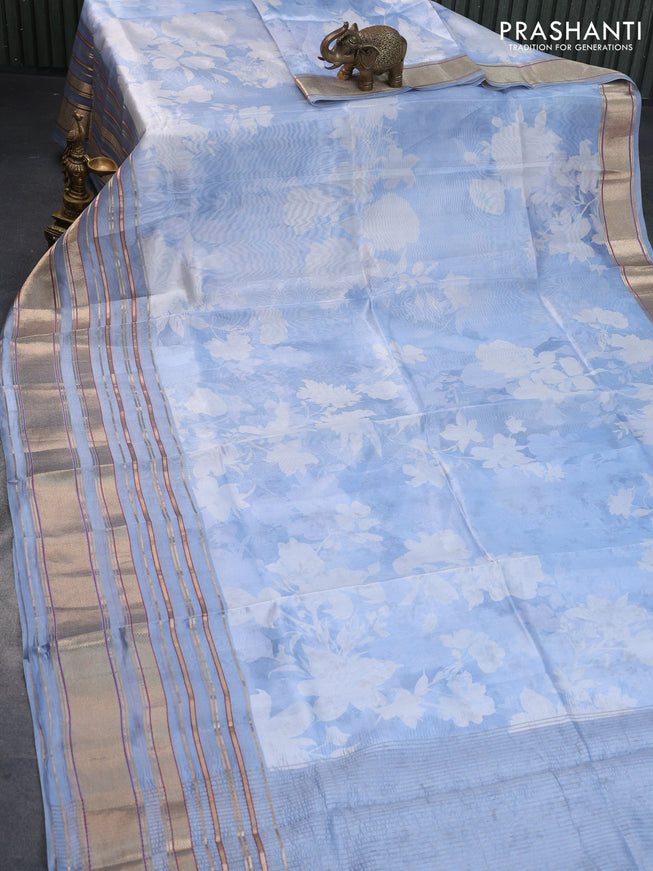 Pure dupion silk saree blue shade with allover floral prints and long zari woven border