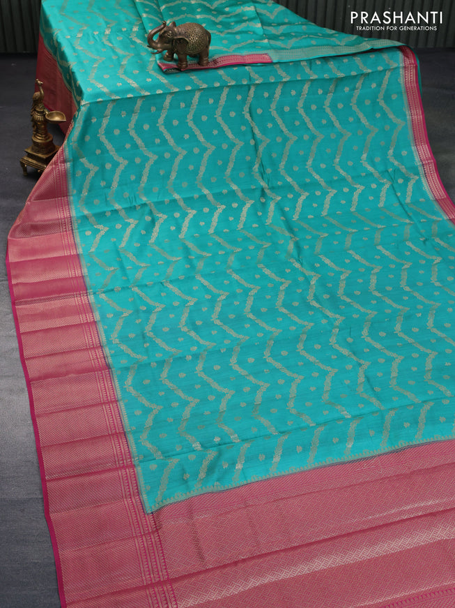 Chiniya silk saree teal green and pink with allover zari weaves and long zari woven border