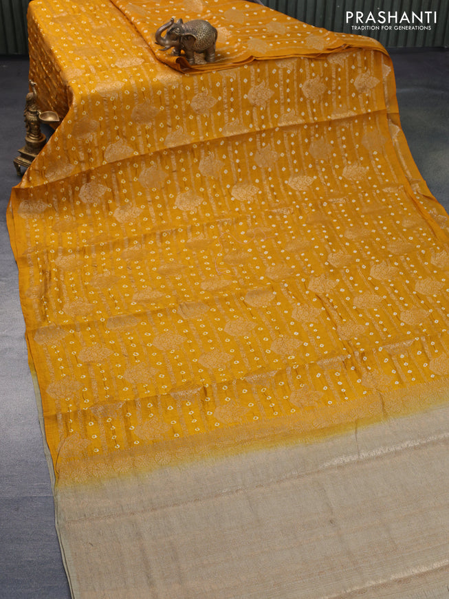 Chiniya silk saree mustard yellow and elaichi green with allover zari weaves & bandhani prints in boderless style