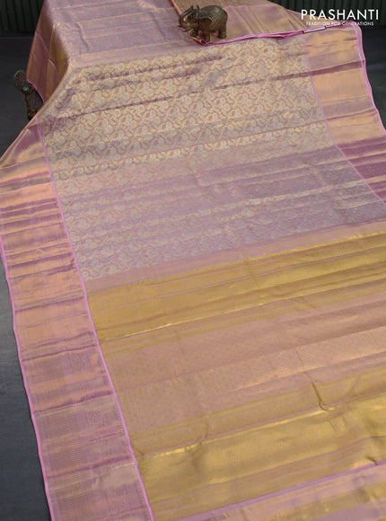 Kanchipuram tissue silk saree dual shade of gold and light pink with allover silver zari woven brocade weaves and long zari woven border