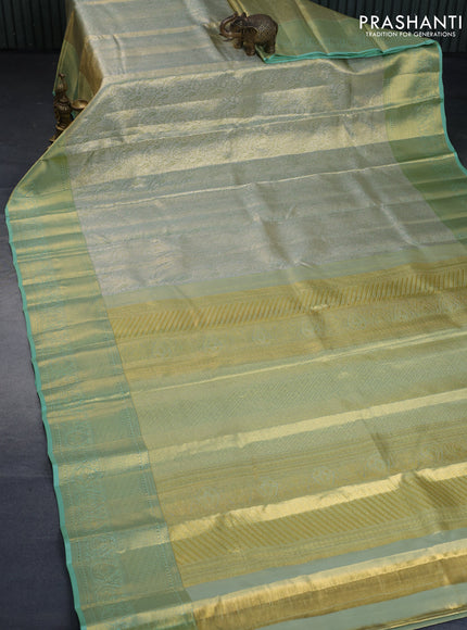 Kanchipuram tissue silk saree dual shade of pastel green with allover silver zari woven brocade weaves and long zari woven border