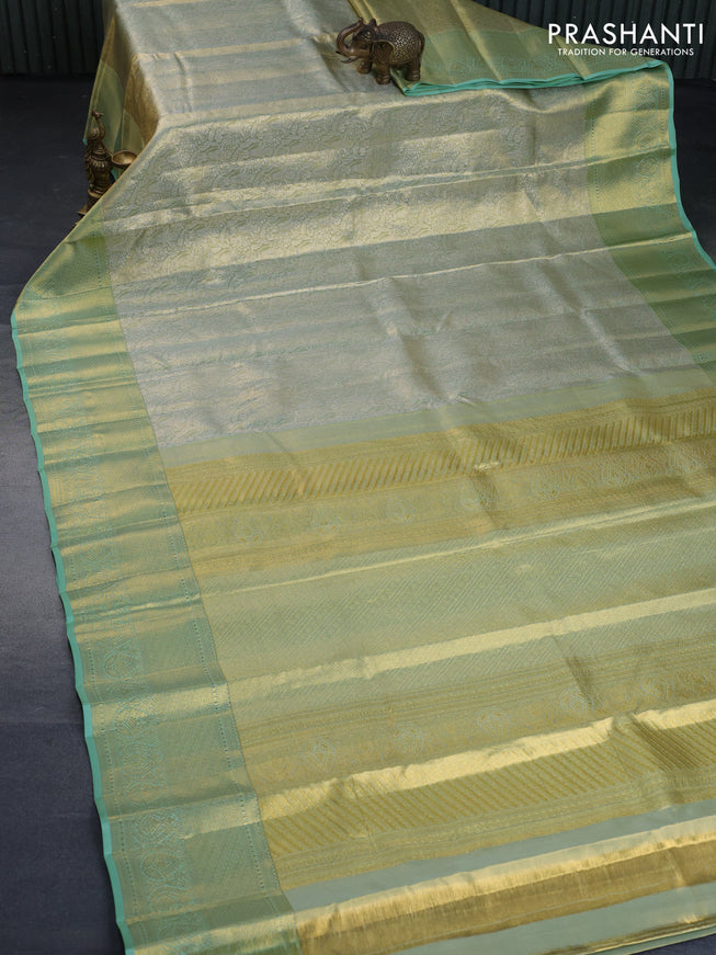 Kanchipuram tissue silk saree dual shade of pastel green with allover silver zari woven brocade weaves and long zari woven border