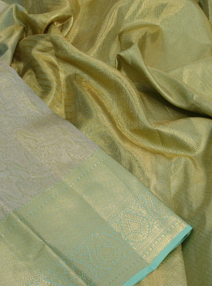 Kanchipuram tissue silk saree dual shade of pastel green with allover silver zari woven brocade weaves and long zari woven border