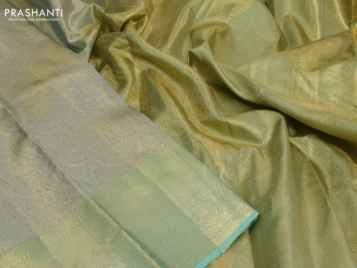 Kanchipuram tissue silk saree dual shade of pastel green with allover silver zari woven brocade weaves and long zari woven border