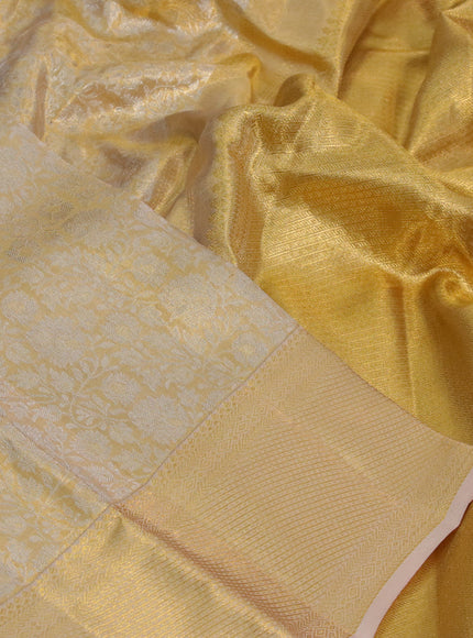 Kanchipuram tissue silk saree gold with allover silver zari woven brocade weaves and zari woven border