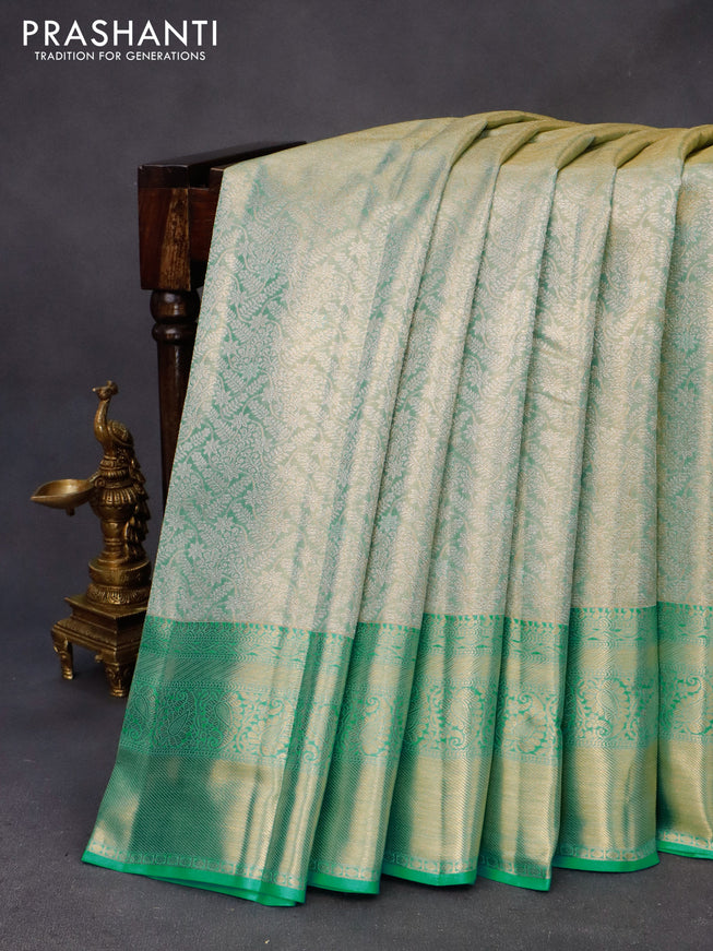 Kanchipuram tissue silk saree dual shade of teal with allover silver zari woven brocade weaves and long zari woven border