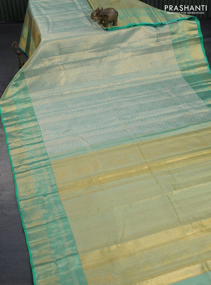 Kanchipuram tissue silk saree dual shade of teal with allover silver zari woven brocade weaves and long zari woven border