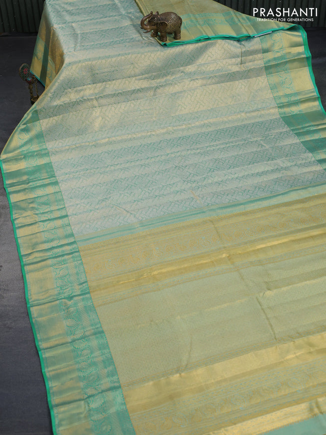 Kanchipuram tissue silk saree dual shade of teal with allover silver zari woven brocade weaves and long zari woven border