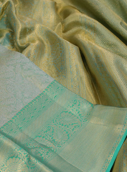 Kanchipuram tissue silk saree dual shade of teal with allover silver zari woven brocade weaves and long zari woven border