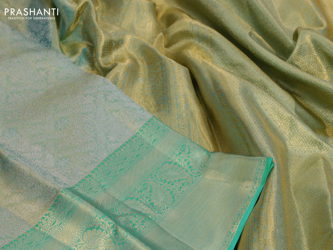 Kanchipuram tissue silk saree dual shade of teal with allover silver zari woven brocade weaves and long zari woven border