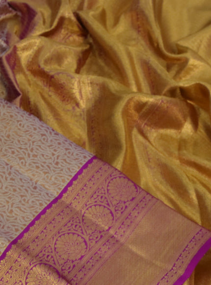 Kanchipuram tissue silk saree dual shade of gold and purple with allover silver zari woven brocade weaves and long zari woven border