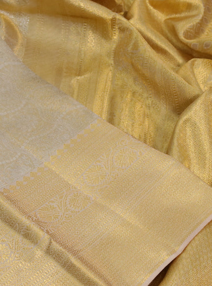 Kanchipuram tissue silk saree sandal with allover silver zari woven brocade weaves and long zari woven border