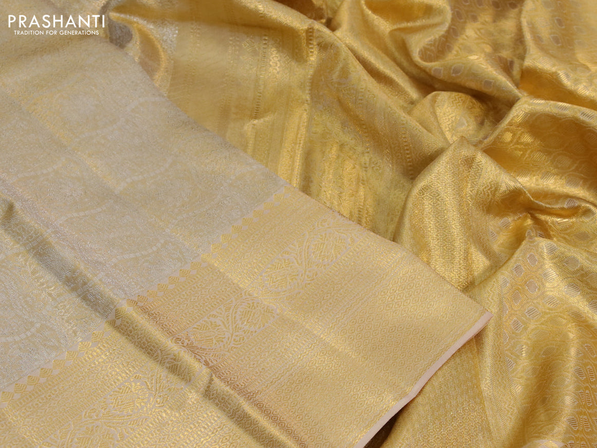 Kanchipuram tissue silk saree sandal with allover silver zari woven brocade weaves and long zari woven border