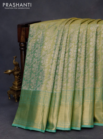 Kanchipuram tissue silk saree dual shade of teal green with allover silver zari woven brocade weaves and zari woven border