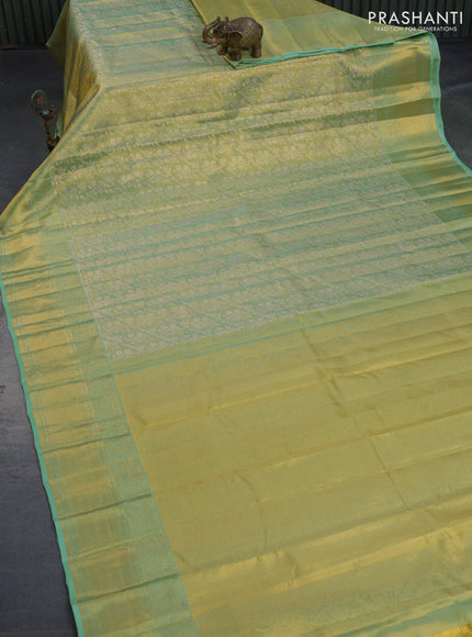 Kanchipuram tissue silk saree dual shade of teal green with allover silver zari woven brocade weaves and zari woven border