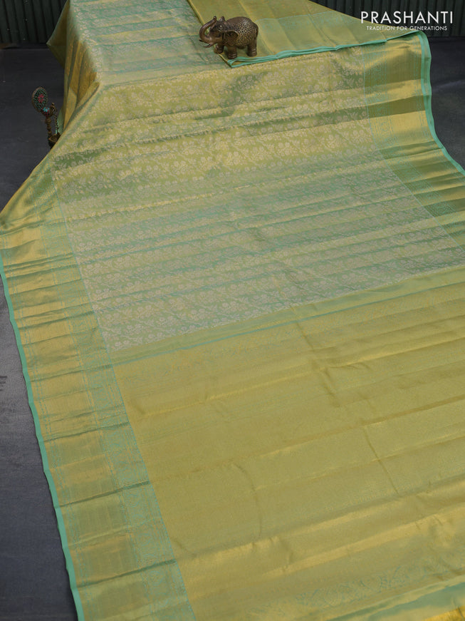 Kanchipuram tissue silk saree dual shade of teal green with allover silver zari woven brocade weaves and zari woven border