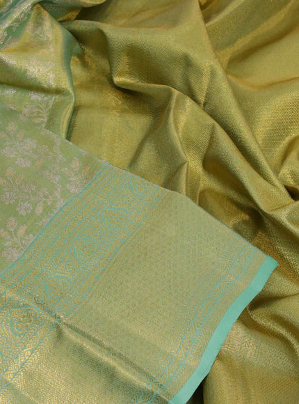 Kanchipuram tissue silk saree dual shade of teal green with allover silver zari woven brocade weaves and zari woven border