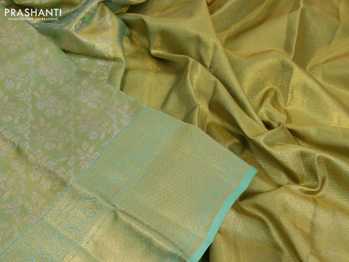 Kanchipuram tissue silk saree dual shade of teal green with allover silver zari woven brocade weaves and zari woven border