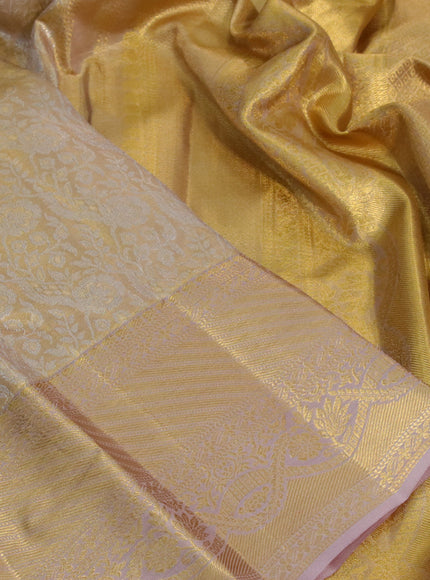 Kanchipuram tissue silk saree sandal with allover silver zari woven brocade weaves and zari woven border