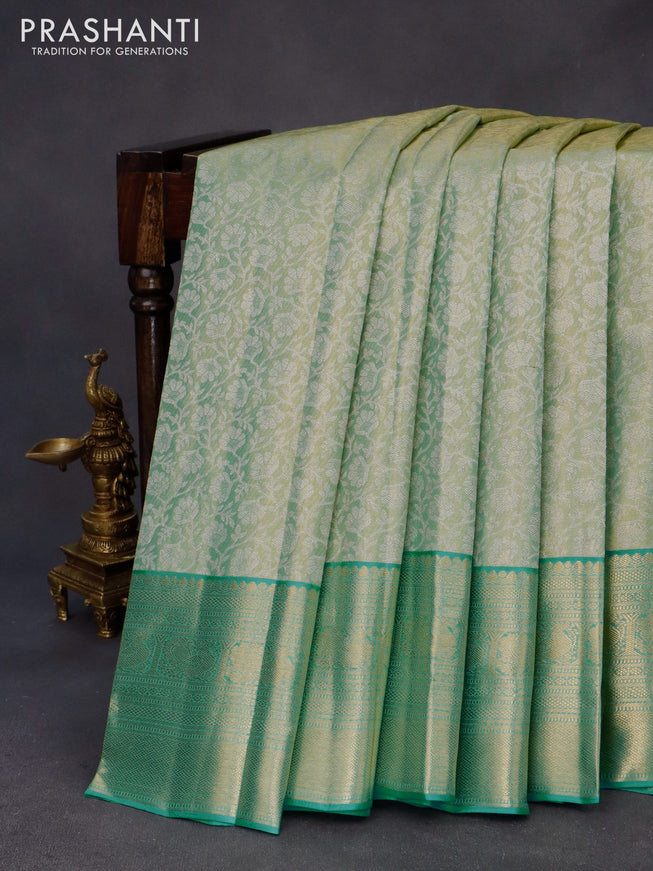 Kanchipuram tissue silk saree dual shade of teal green and teal blue with allover silver zari woven floral brocade weaves and zari woven border