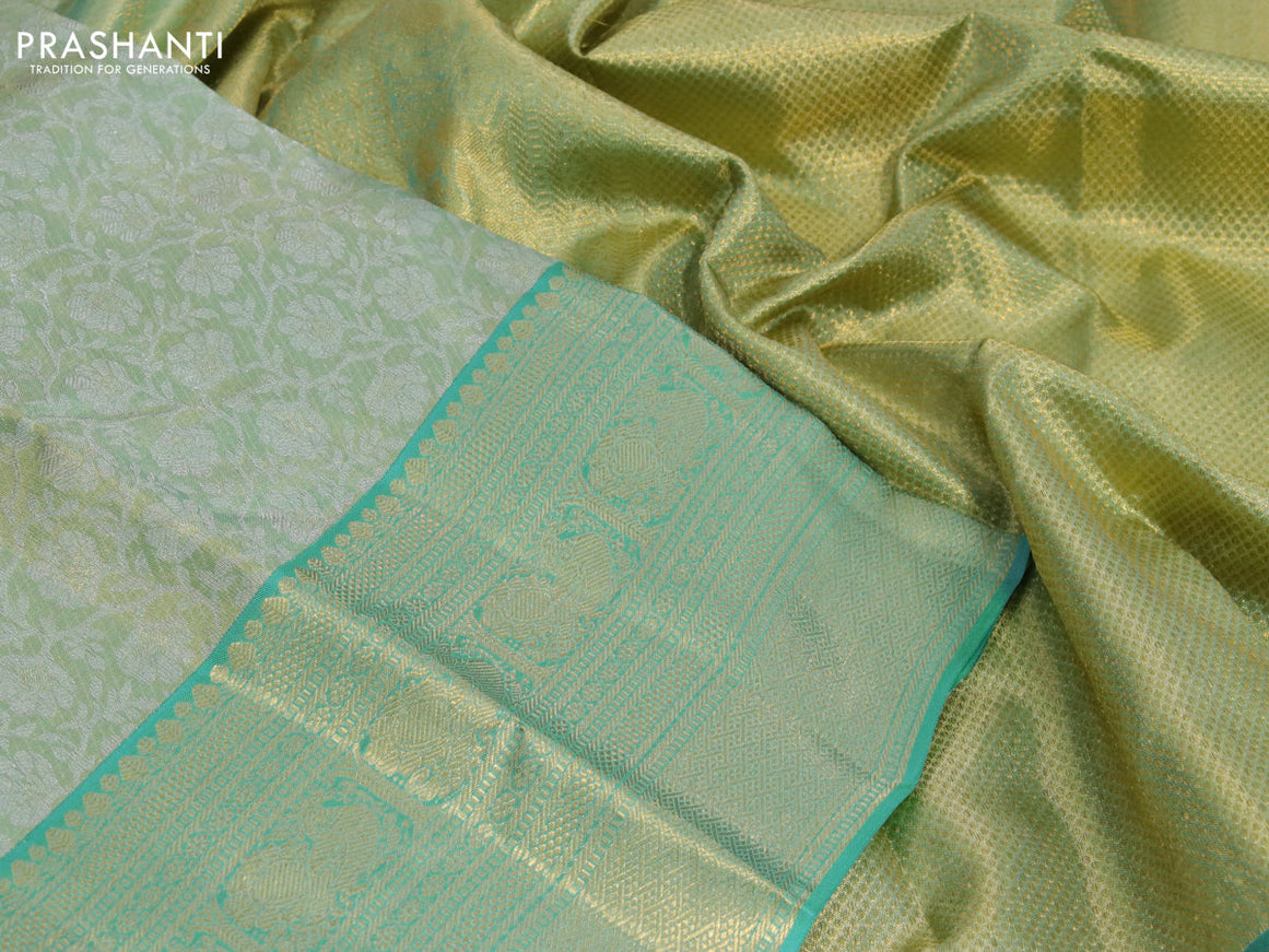 Kanchipuram tissue silk saree dual shade of teal green and teal blue with allover silver zari woven floral brocade weaves and zari woven border