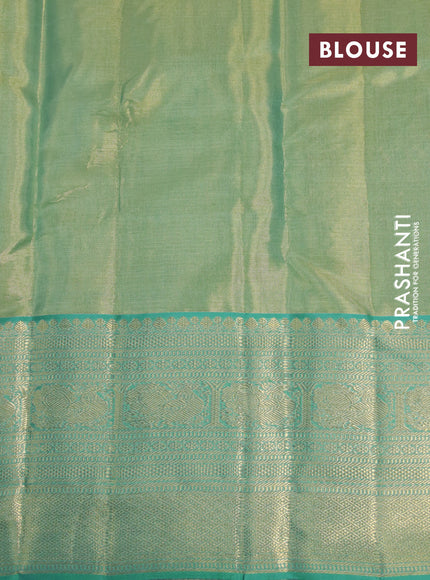 Kanchipuram tissue silk saree dual shade of teal green and teal blue with allover silver zari woven floral brocade weaves and zari woven border