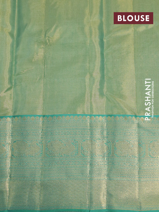 Kanchipuram tissue silk saree dual shade of teal green and teal blue with allover silver zari woven floral brocade weaves and zari woven border