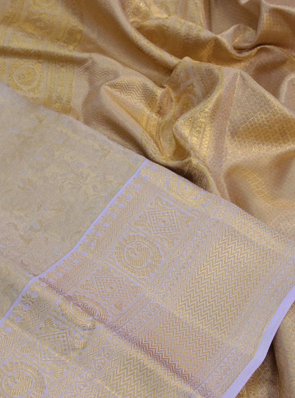 Kanchipuram tissue silk saree dual shade of gold and lavender shade with allover silver zari woven brocade weaves and zari woven border