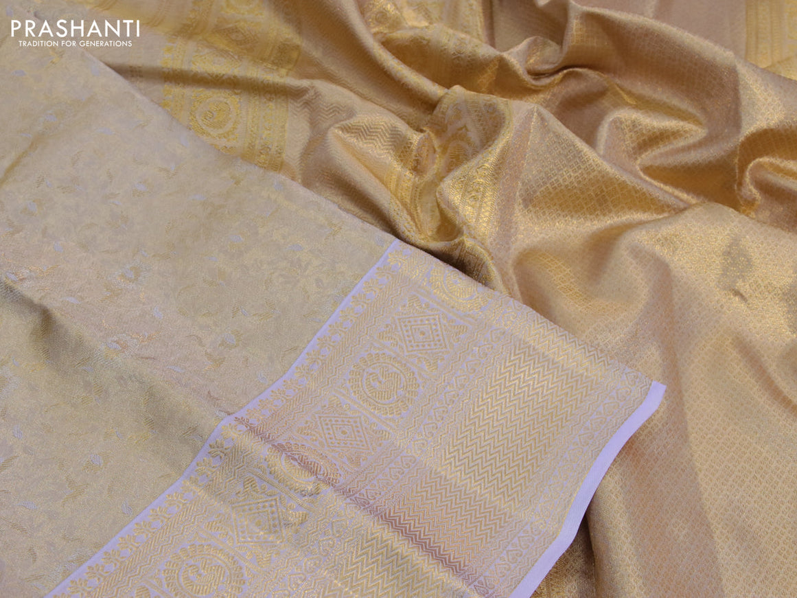 Kanchipuram tissue silk saree dual shade of gold and lavender shade with allover silver zari woven brocade weaves and zari woven border