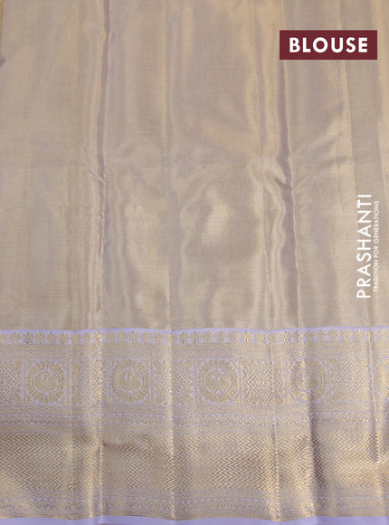 Kanchipuram tissue silk saree dual shade of gold and lavender shade with allover silver zari woven brocade weaves and zari woven border