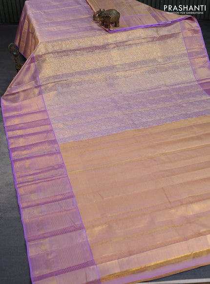 Kanchipuram tissue silk saree dual shade of gold and lavender shade with allover zari woven brocade weaves and long zari woven border