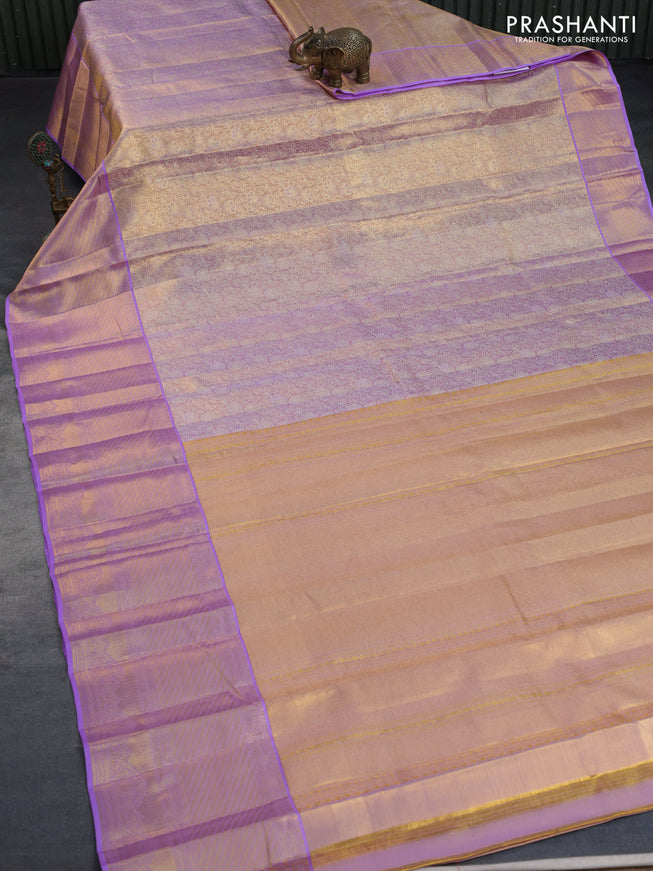 Kanchipuram tissue silk saree dual shade of gold and lavender shade with allover zari woven brocade weaves and long zari woven border