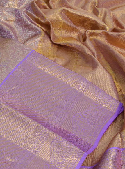 Kanchipuram tissue silk saree dual shade of gold and lavender shade with allover zari woven brocade weaves and long zari woven border