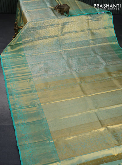 Kanchipuram tissue silk saree dual shade of teal blue with allover silver zari woven brocade weaves and long zari woven border