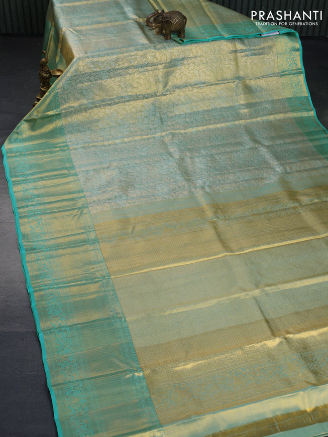 Kanchipuram tissue silk saree dual shade of teal blue with allover silver zari woven brocade weaves and long zari woven border