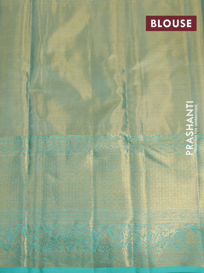 Kanchipuram tissue silk saree dual shade of teal blue with allover silver zari woven brocade weaves and long zari woven border