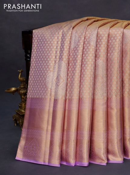 Kanchipuram tissue silk saree dual shade of lavender with allover silver zari woven brocade weaves and long zari woven border