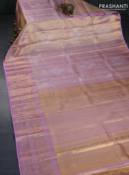 Kanchipuram tissue silk saree dual shade of lavender with allover silver zari woven brocade weaves and long zari woven border