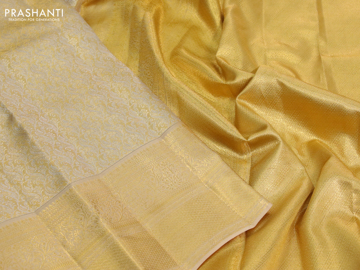 Kanchipuram tissue silk saree sandal with allover silver zari woven brocade weaves and zari woven border