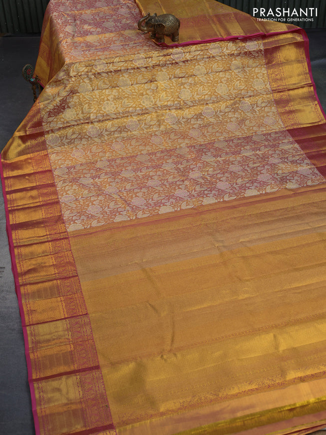 Kanchipuram tissue silk saree dual shade of gold and pink with allover zari woven brocade weaves and long zari woven border