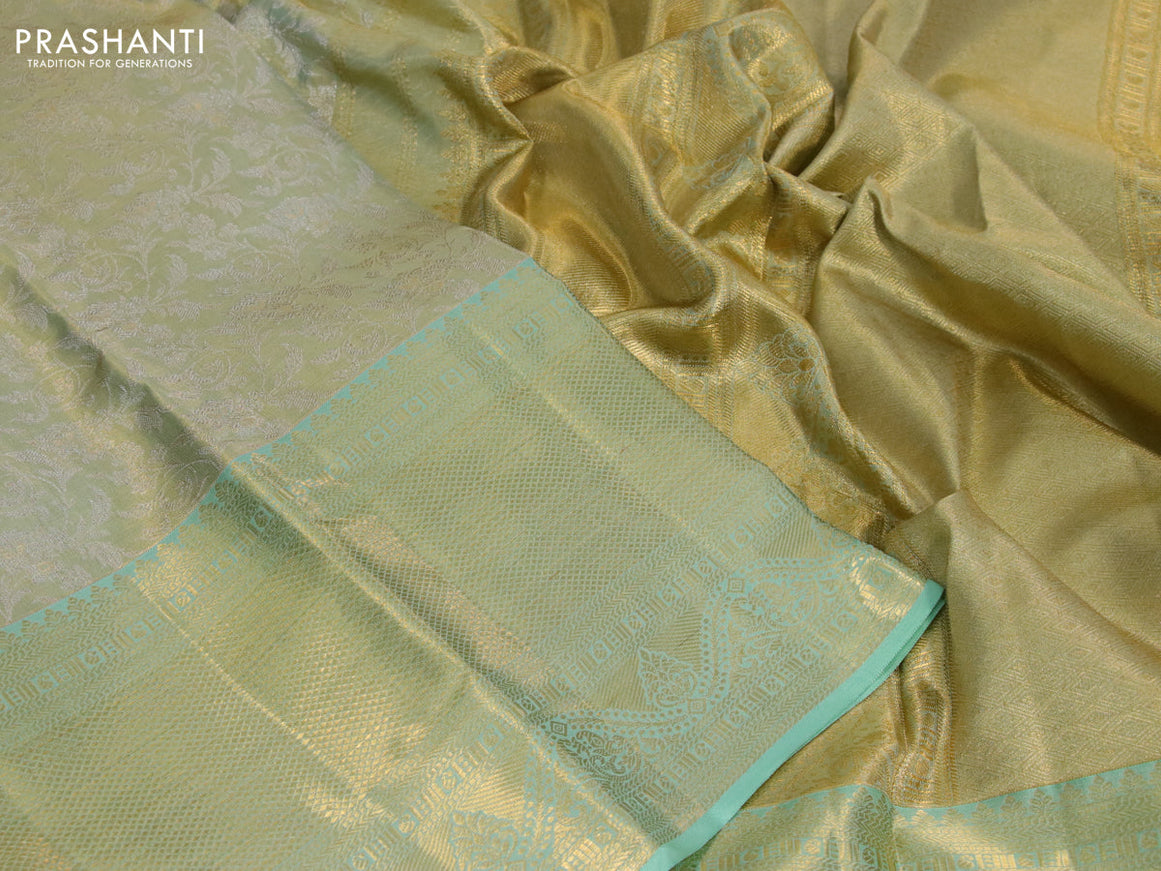 Kanchipuram tissue silk saree dual shade of teal green with allover silver zari woven brocade weaves and long zari woven border