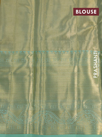 Kanchipuram tissue silk saree dual shade of teal green with allover silver zari woven brocade weaves and long zari woven border