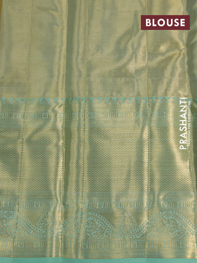 Kanchipuram tissue silk saree dual shade of teal green with allover silver zari woven brocade weaves and long zari woven border