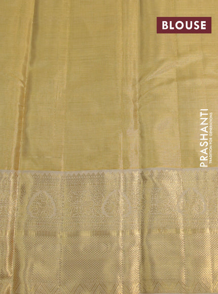 Kanchipuram tissue silk saree sandal and cream with allover silver zari woven brocade weaves and long zari woven border