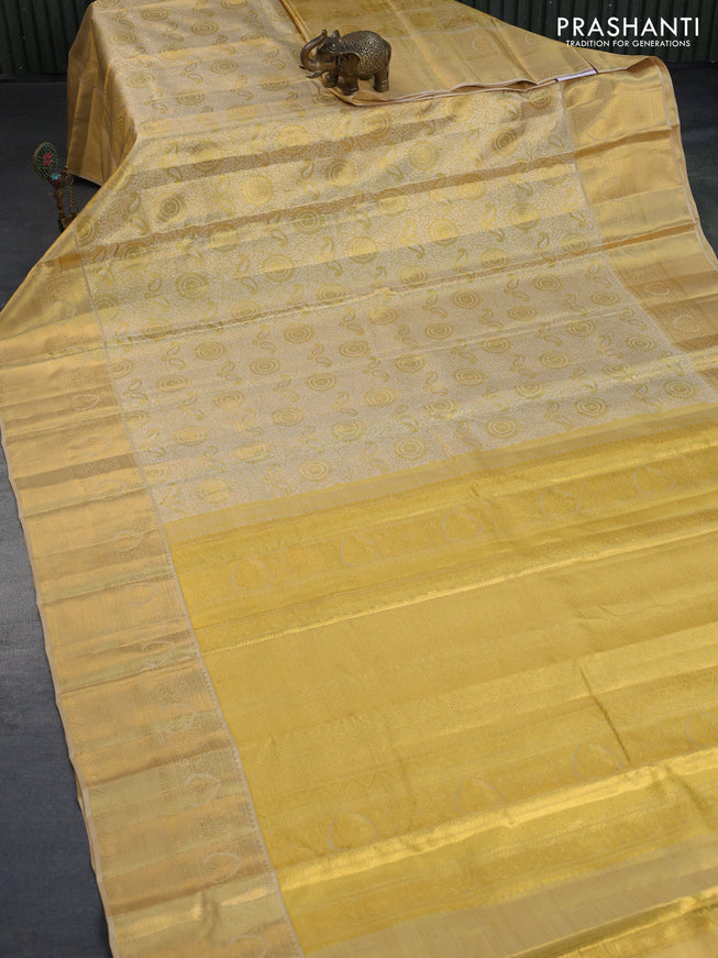 Kanchipuram tissue silk saree dual shade of gold and sandal with allover silver zari woven brocade weaves and long zari woven border