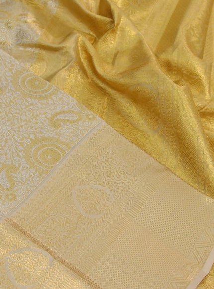 Kanchipuram tissue silk saree dual shade of gold and sandal with allover silver zari woven brocade weaves and long zari woven border