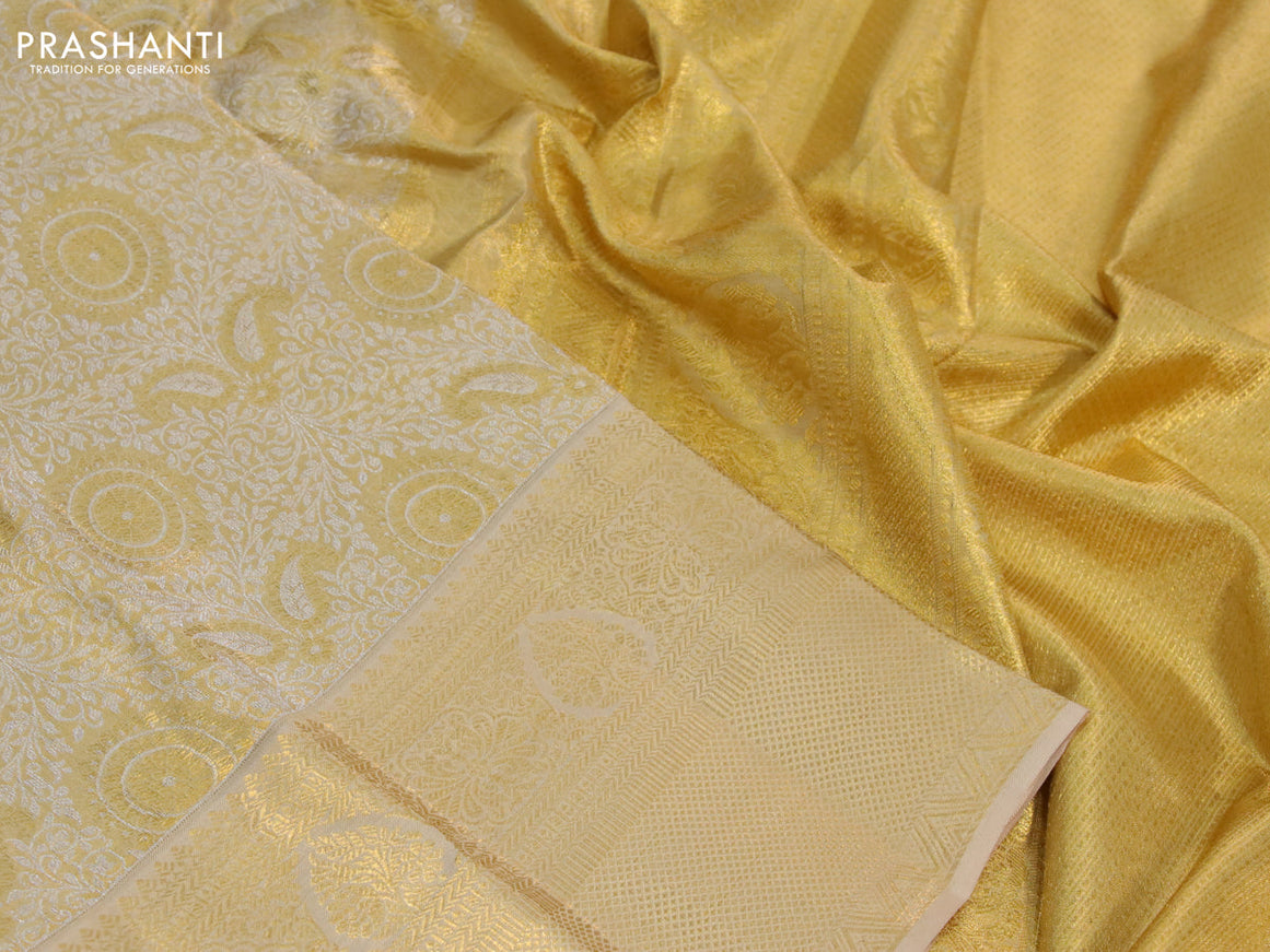 Kanchipuram tissue silk saree dual shade of gold and sandal with allover silver zari woven brocade weaves and long zari woven border