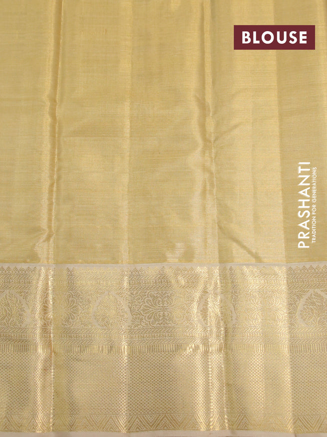 Kanchipuram tissue silk saree dual shade of gold and sandal with allover silver zari woven brocade weaves and long zari woven border