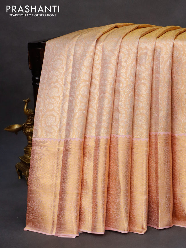 Kanchipuram tissue silk saree dual shade of mild peach with allover silver zari woven brocade weaves and long zari woven border